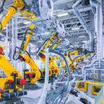 robotic arms in a car plant